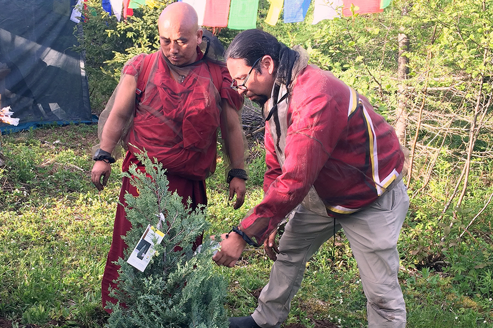 Khenpo Karma Tenkyong and Jeff Ward planting a tree